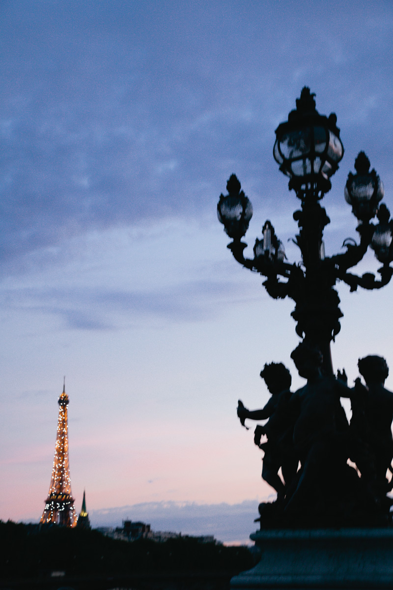 eiffel-tower-lights-up-summer-dusk-paris