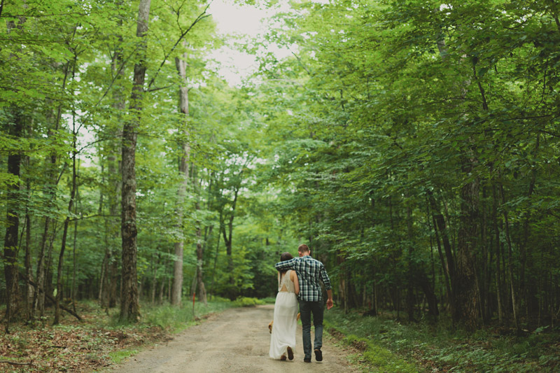 couple walking through forest engagement