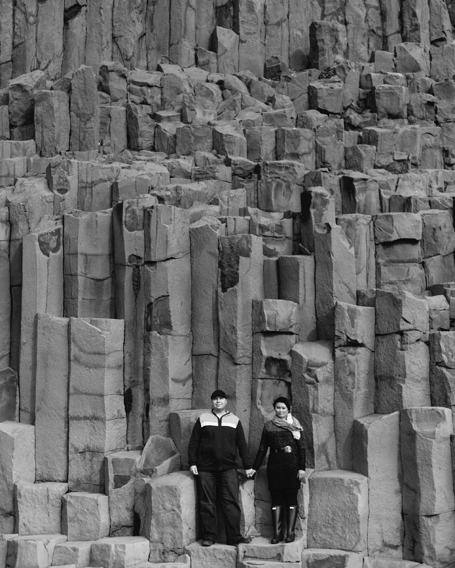 black sand beach couples pictures rock formations