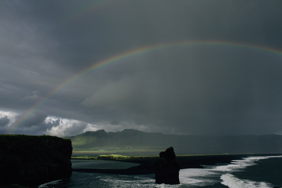 Black sand beach Iceland rainbow