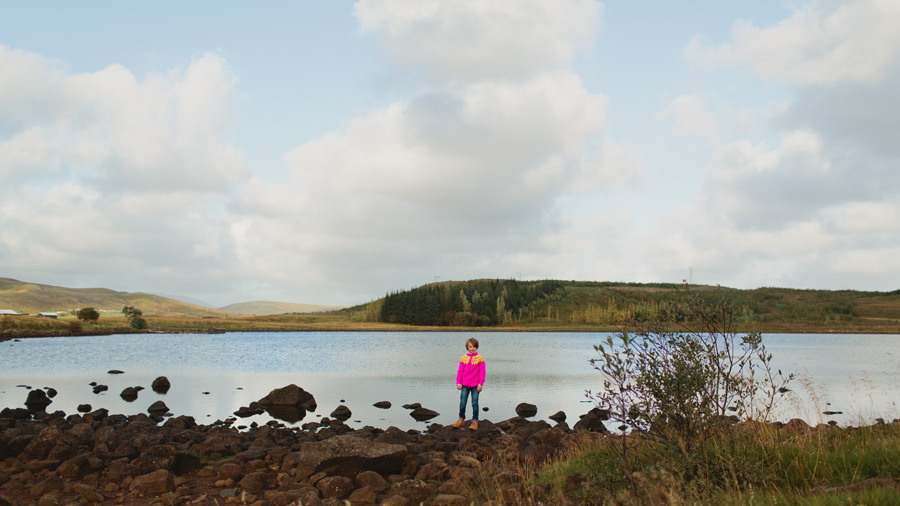 girl standing by the lake