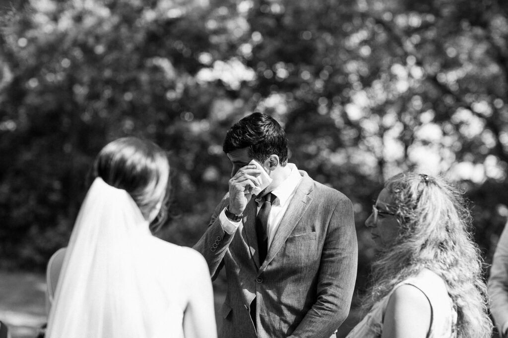 A candid moment during the wedding ceremony captured by documentary Toronto wedding photographer Janice Yi